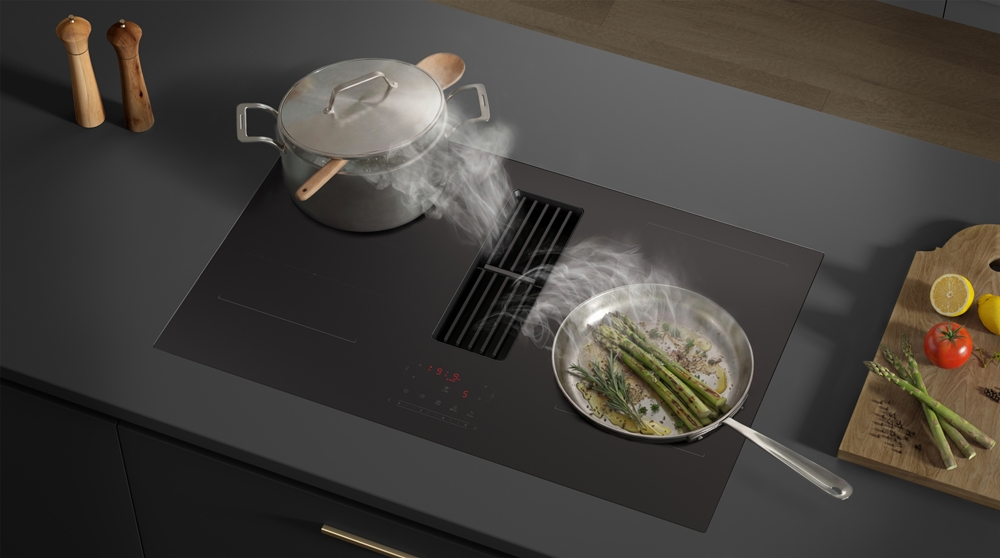 samsung infinite line hood-integrated induction showing cooking